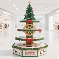 Présentoir en papier sur pied rotatif écologique à 4 niveaux pour la promotion de vacances de jouets de collations de centre commercial sur le thème de Noël