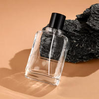 Bouteille d'huile essentielle en verre bouclé de forme de luxe vide au design unique Bouteille d'eau parfumée avec couvercle noir