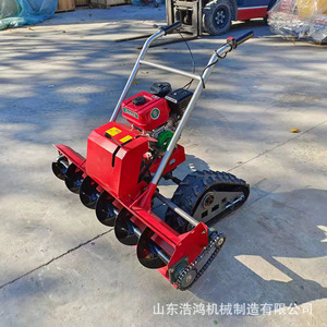 Mini barredora de nieve autopropulsada con motor rojo para uso en propiedades y estanques - Product Image 1
