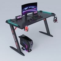 Bureau de jeu LEIENTE avec ports de charge USB et éclairage LED, bureau d'ordinateur en forme de L réversible avec étagères de rangement et support pour moniteur