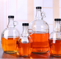 Bouteille en verre transparente de qualité alimentaire avec poignée en forme de boucle et bouchon à vis pour les bouteilles de vin rouge fait maison
