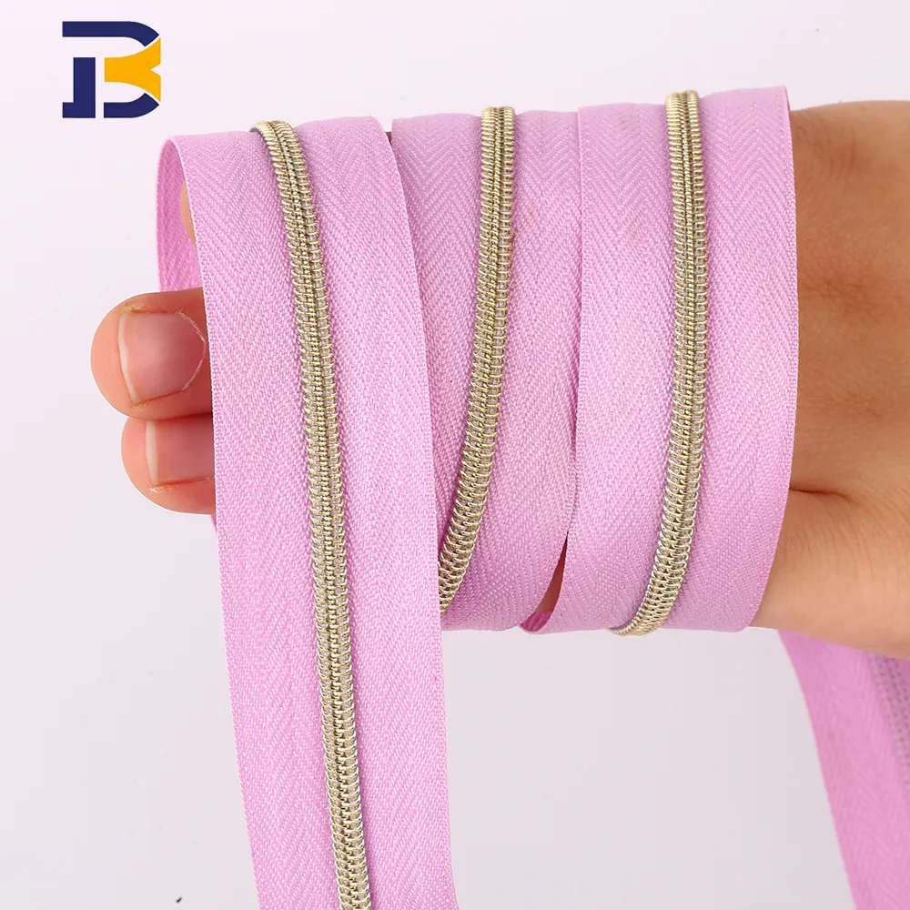 Vente en gros 3 #5 # longue chaîne en nylon à glissière avec dents en or accessoires de couture bobine de fermeture à glissière en nylon pour sacs à vêtements.