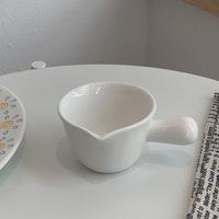 Petite coupelle à sauce en céramique colorée de style nordique avec poignée, idéale pour les fêtes, pour le lait, la crème et les assaisonnements