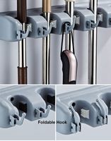 Support mural moderne en plastique noir pour balais, balais à poussière et manches de serpillères, organisateur d'outils pour salle de bain d'hôtel