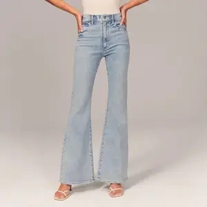 Pantaloni jeans donna con tasche con bottone lungo di alta qualità taglie forti