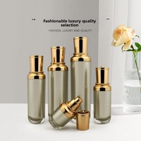 Flacons en acrylique pour cosmétiques, sérum, lotion, crème pour le visage, fond de teint, avec bouchon en plastique doré en forme de fleur, pot cylindrique en stock