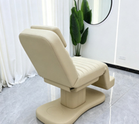 Lit de massage électrique réglable avec accoudoirs en velours noir et piédestal doré pour spa et clinique de beauté