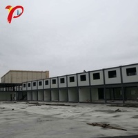 Entrepôt 2 étages garage cottage kits fournisseur moins cher 40ft 2 chambre à coucher en forme de capsule conteneur pas cher maisons préfabriquées