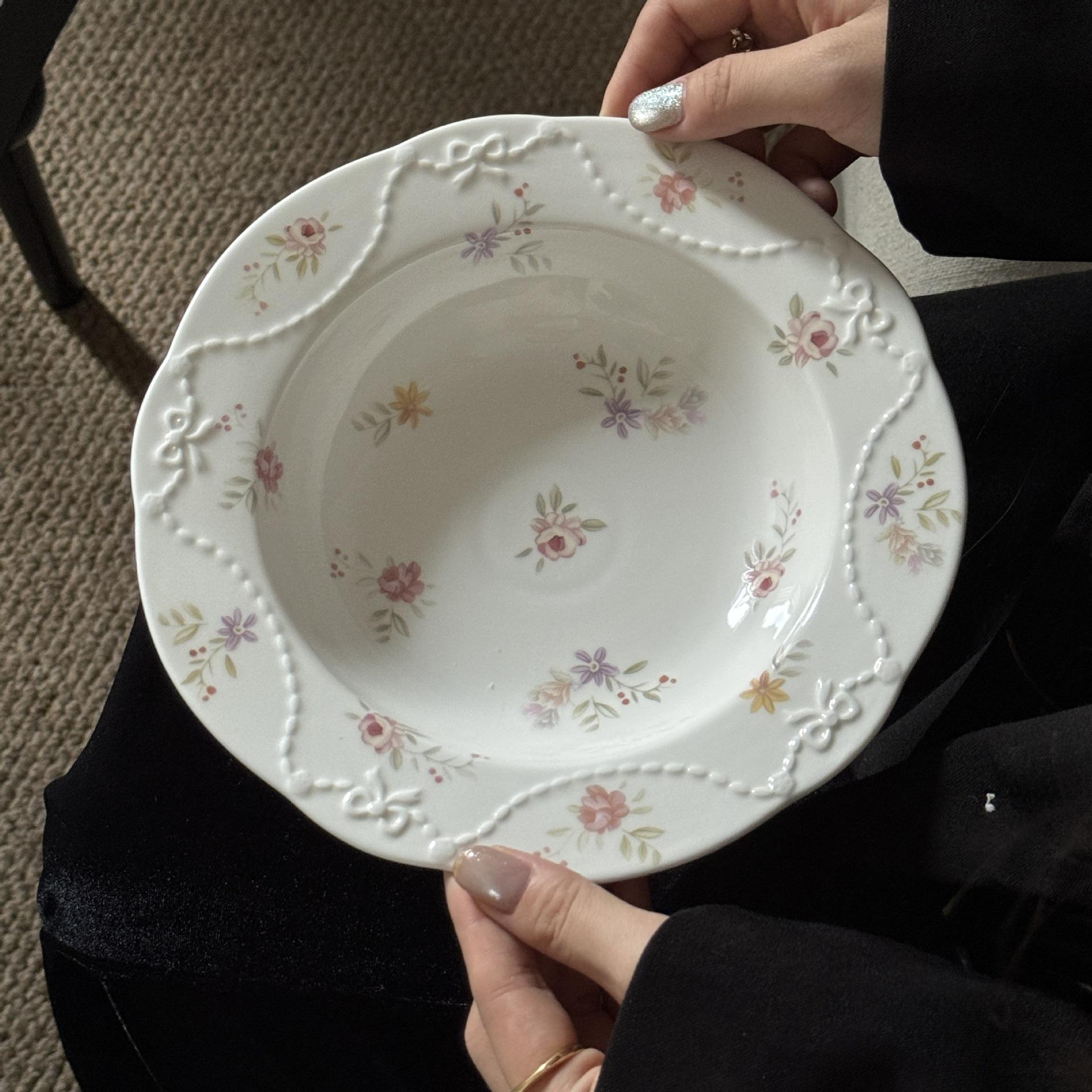 A floral soup plate of the fugitive princess