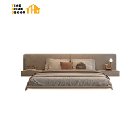Cadre de lit en bois massif italien moderne minimaliste de luxe, taille Queen ou King, avec revêtement en cuir véritable et rangement