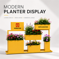 Support de présentation de plantes en métal jaune moderne et durable, résistant à l'eau, pour centre commercial, jardinières à plusieurs niveaux, logo personnalisé, mobilier d'extérieur