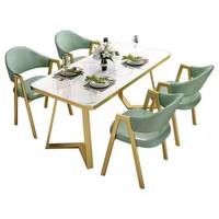 Ensemble de table à manger en marbre de luxe moderne avec chaises en cuir PU et cadre doré, meubles pour salle à manger, café, restaurant