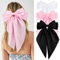 Accessoires de cheveux pour femmes tendance : Grande pince à cheveux nœud rose en satin