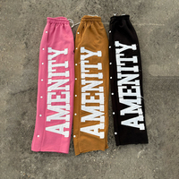 Pantalon de jogging personnalisé pour homme avec appliques brodées sur le côté, rivets délavés pour ourlet brut, logo brodé style Hip Hop