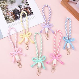 Nouveaux porte-clés tressés en forme de nœud, lanières de poignet tissées unies aux couleurs arc-en-ciel pour téléphones et sacs, breloques décoratives pour sacs, accessoires promotionnels - Product Image 2
