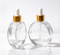 Flacon compte-gouttes rond en verre transparent vide de 20 ml pour sérum, huile capillaire ou huile essentielle, avec logo personnalisé, sérigraphié et estampé or