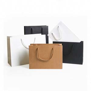 KM Prix de gros bon marché Sacs de shopping en papier d'art de luxe personnalisés imprimés créatifs réutilisables pour les vêtements - Product Image 1