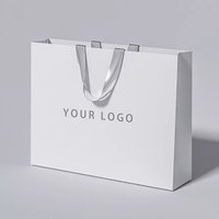 Sacs en papier personnalisés de luxe rose pour vêtements, avec votre propre logo, poignées, sacs promotionnels pour la vente au détail, sacs cadeaux en papier pour l'emballage