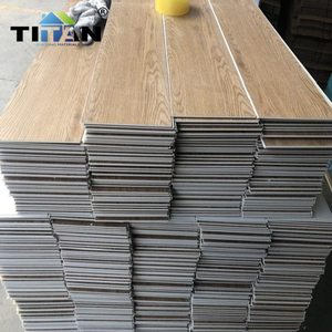 Piso Laminado Spc Suelos De Pvc Bodenbelag Vinilo Holz Herringbone Suelo De Vinilo Grano De Madera Spc Suelo 5Mm Impermeable - Product Image 1