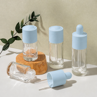 Botol Serum Kaca Bulat Bening 20ml 30ml dengan Dasar Tebal dan Pipet Tetes untuk Minyak Esensial dengan Logo Kustom