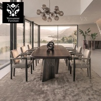 Table à manger à coins arrondis avec pieds en colonne superposés, mobilier de salle à manger aspect marbre haut de gamme, table à manger à bords incurvés