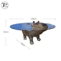 Table basse créative moderne en fibre de verre en forme d'hippopotame avec dessus en verre rond