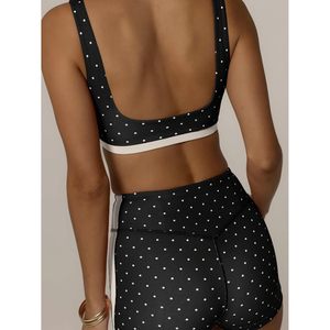 Ensemble de sport ajusté pour femme : crop top à pois et short cycliste taille haute, sans manches, idéal pour le yoga - Product Image 1