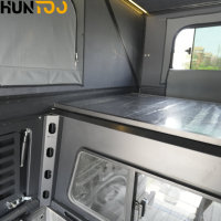 Caravana desplegable de aluminio Huntoo con techo rígido para camionetas, ideal para acampar en la montaña y viajar.