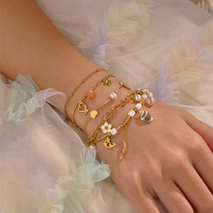 Pulsera <span class=keywords><strong>de</strong></span> la <span class=keywords><strong>Amistad</strong></span> <span class=keywords><strong>de</strong></span> Moda en Acero Inoxidable con Baño <span class=keywords><strong>de</strong></span> Oro <span class=keywords><strong>de</strong></span> 18K, Cuentas <span class=keywords><strong>de</strong></span> Piedra Natural, Perlas <span class=keywords><strong>de</strong></span> Concha y Diseño <span class=keywords><strong>de</strong></span> Flor y Corazón Trenzado - Product Image 1