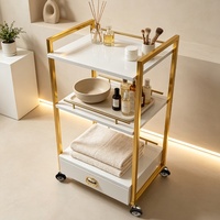 Chariot de Salon de Beauté à 3 Niveaux avec Tiroir, Cadre Métallique Doré, Chariot de Rangement Mobile à Roulettes pour Utilisation en Spa et Salon