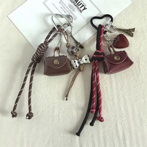 Hot-selling Instagram-style Cute Style <b>Leather</b> Mini Bag <b>Keychain</b> Niche Pendant Creative Schoolbag Wholesale - Product Image 4