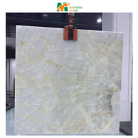Dalle de marbre blanc de l'âge glacial naturel, marbre onyx blanc, mur rétroéclairé, table à manger photoélectrique, îlot de cuisine, crédence