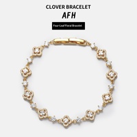 Bracelet de luxe pour femme, style européen et américain, en alliage électroplaqué, avec zircone cubique et motif trèfle à quatre feuilles