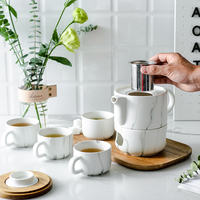 Service à thé en porcelaine céramique de luxe de style nordique exquis, avec fonction de chauffage par bougie, nouveau design, emballage cadeau couleur, vente en gros