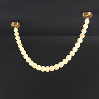 Lustre moderne de luxe en albâtre avec pendentif LED en forme de boule de perles, idéal pour chambre, hôtel et décoration intérieure