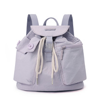 Sac à dos élégant en nylon léger et imperméable avec cordon de serrage, poche intégrée, idéal pour les voyages, l'école, les activités de plein air et l'usage quotidien