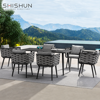 Ensemble de table et chaises de salle à manger d'extérieur en tissu imperméable tissé à la main en alliage d'aluminium moderne pour patio, villa, hôtel et salon