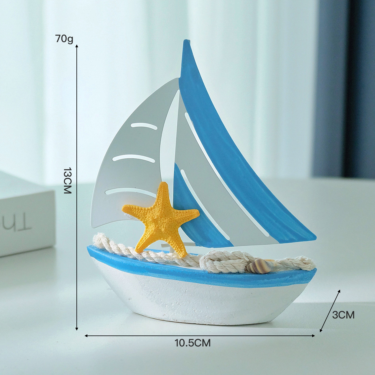 Iron sailboat with light blue starfish