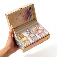 Boîte d'emballage de luxe personnalisée en forme de livre avec insert en mousse, faible MOQ, livraison rapide, pour 3 flacons de parfum avec fermeture à ruban