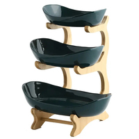 Assiette à fruits en céramique multicouche très vendue avec support en bois pour la cuisine, conception OEM ODM, emballée en boîte