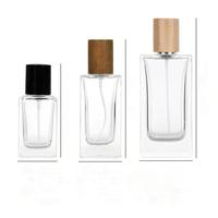 Flacon de parfum en verre transparent bleu plat de 50 ml en gros, 1,7 oz, parfum pour homme, vaporisateur à pompe à sertir de 15 mm, diffuseur de roseaux, MOQ