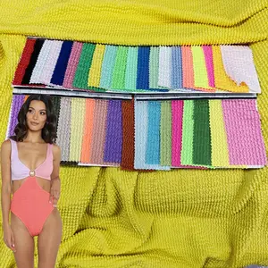 Free sample 95cm 300g spandex polyester wrinkle stretch jacquard fabric knitted bubble swimsuit crinkle fabric for bikini