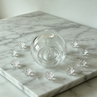 Flacon compte-gouttes en verre transparent rond créatif de 30 ml avec étiquettes personnalisées OEM/ODM pour le stockage d'huiles essentielles, de parfums et d'essences
