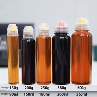 Vente en gros PET 500g Bouteille ronde transparente avec embout Valve en silicone pour sauce au miel