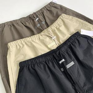 Pantalones cortos informales con cordón transpirables de secado rápido para hombre, técnicas de estiramiento reflectantes teñidas lisas altas, populares en Europa - Product Image 3