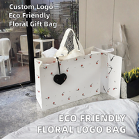STARIVER Sac cadeau en papier écologique fait main, classique, avec logo personnalisé, motif floral, poignée en ruban de satin, impression à chaud pour vêtements