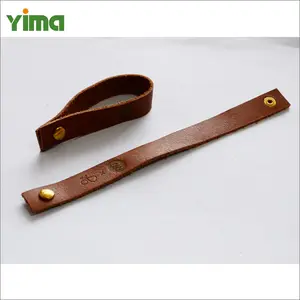 Yiwu wholesale customizable deboss emboss print logo leather label that can be folded in the middle with holes for shoes tongue