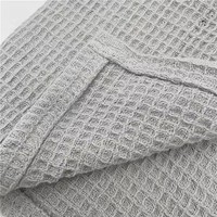 Couverture tricotée réversible en flanelle/polaire 100 % coton, douce et portable, pour toutes les saisons, idéale pour les siestes en avion ou en salon.