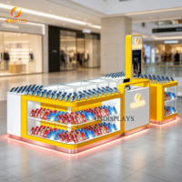 Kiosque d'accessoires téléphoniques éclairé par LED, vitrine d'exposition de téléphones portables en îlot arrondi blanc, orange et rouge pour centre commercial