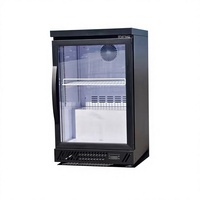 Réfrigérateur minibar à double zone de température pour hôtel, avec porte en verre trempé, adapté au réfrigération des boissons.